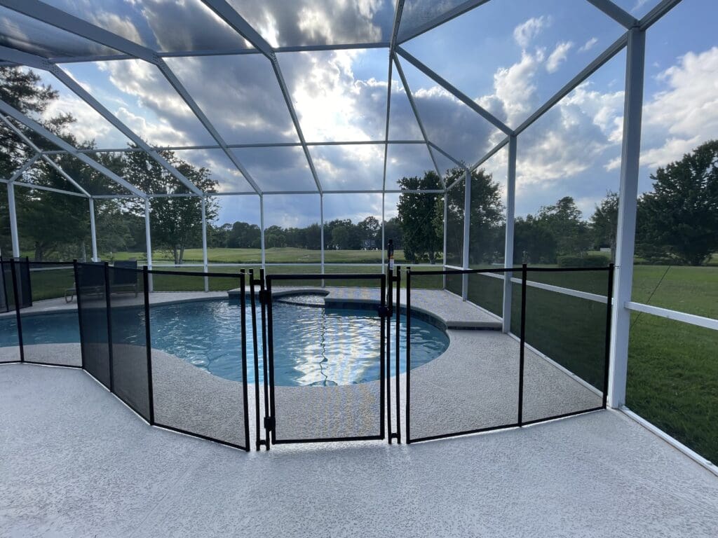 Resurfaced pool with new tile and a child gate added