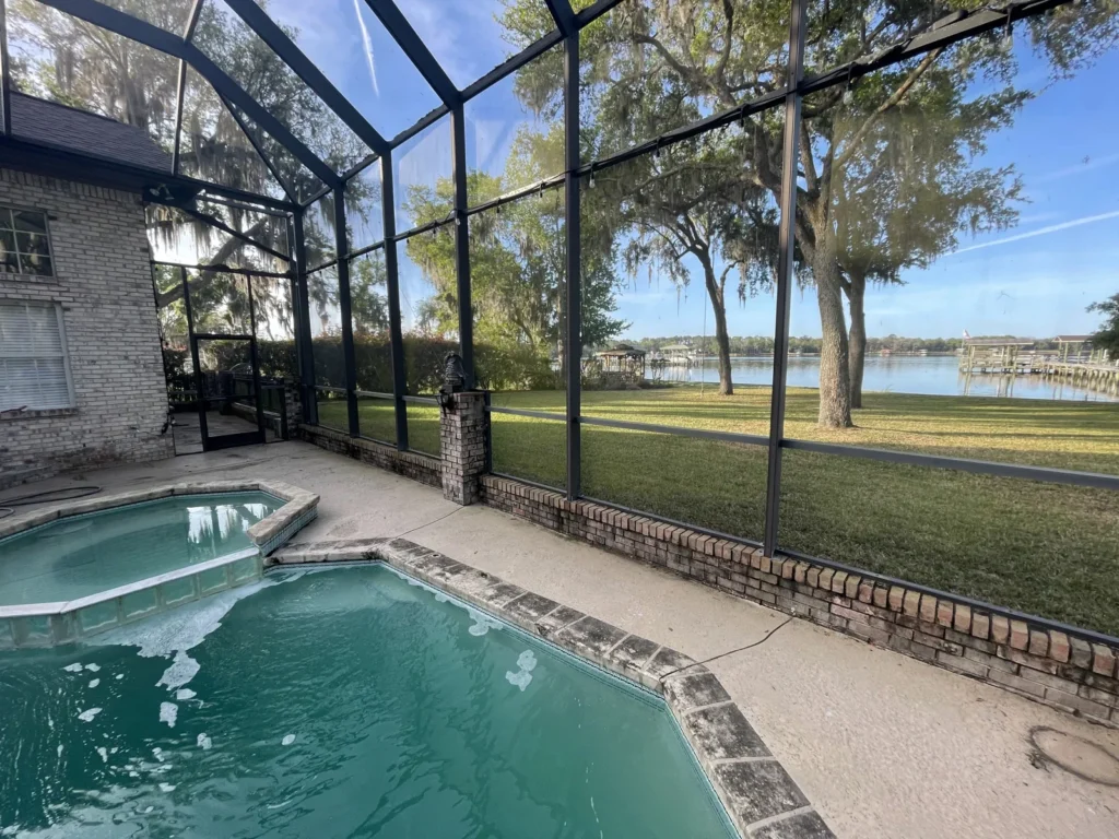 Screened pool overlooking open water in Northeast Florida